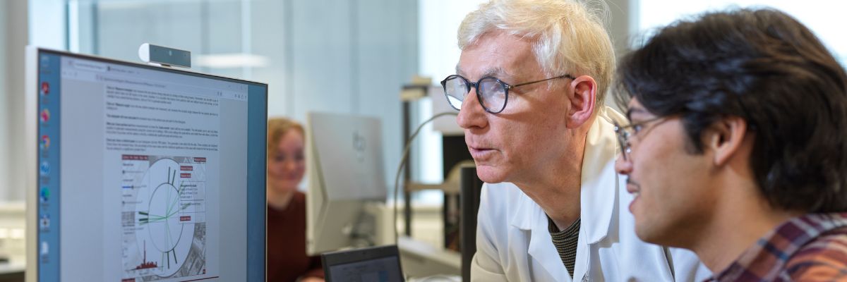 A technician helping a physics student :)