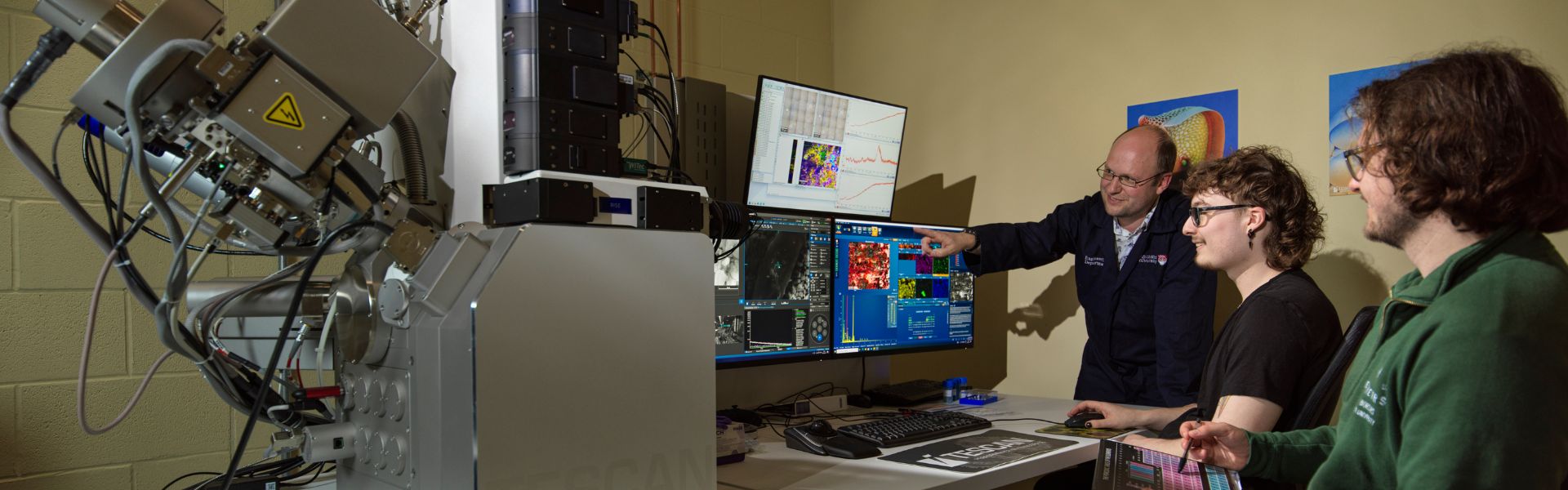 A technician opperating the SEM in Engineering