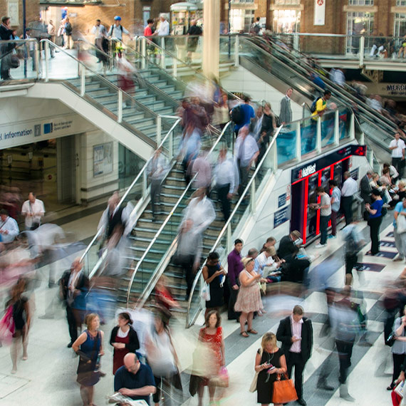 People on the stairs and escalators in a shopping centre