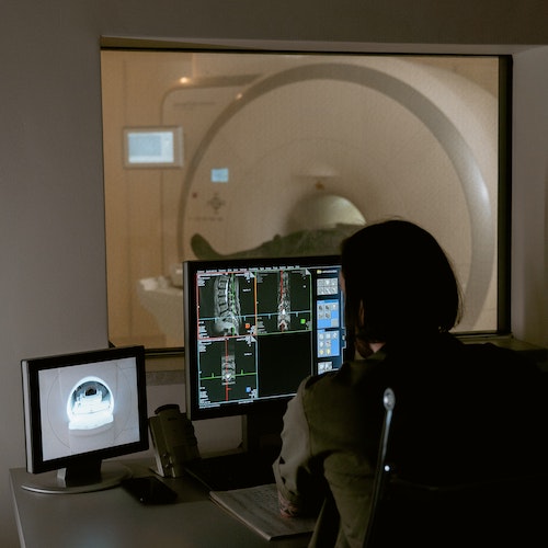 A doctor conducting an MRI scan