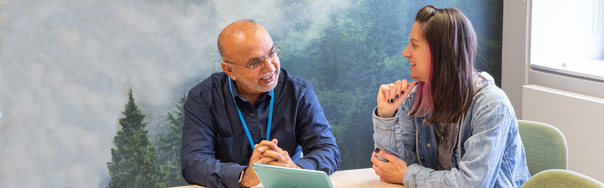 Students seated and working in Lancaster University library