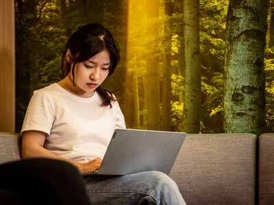 A person working on their laptop.