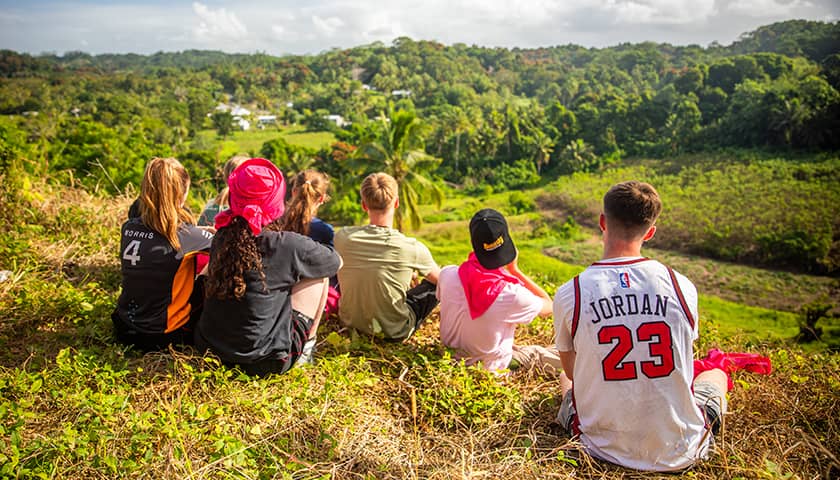 Group photo of Lancaster University students looking out over view point in Fiji