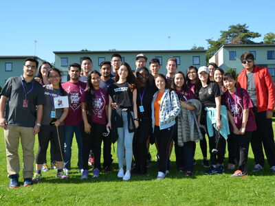 Summer school students standing outside in the sun.