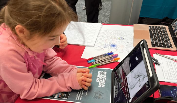 Young girl seeing her Ruskin style unicorn creation