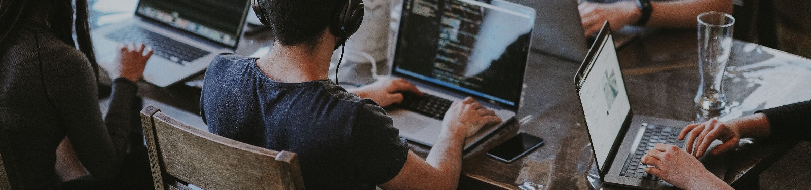 Banner saying meet the team with a team icon and a swirly hi sign 