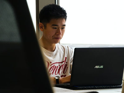 Pink clouds with a flock of birds flying through them.