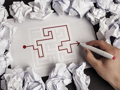 A maze with a red pen showing how to escape.