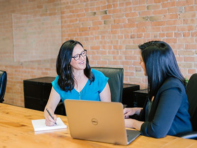 A woman giving feedback to another woman.