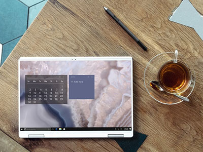 Laptop and mug of coffee on a table.