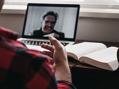 A man on a 1 to 1 video call.
