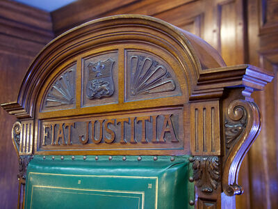 Mock courtroom at Lancaster showing the text fiat justitia
