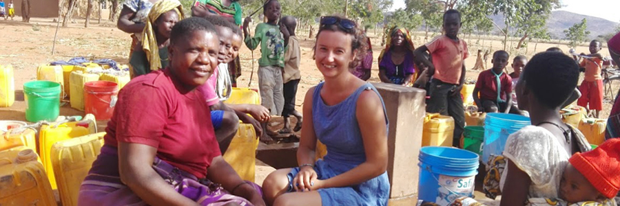 Dan Evans holds a globe showing soil types across the world