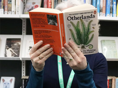 Person reading a book.