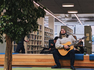 Image of Benson Wilson performing in the library