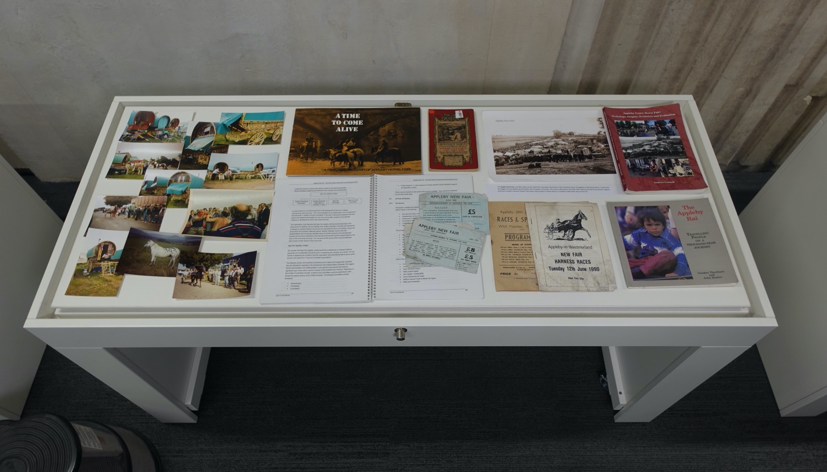 Exhibition case with photographs and documents related to Appleby Horse Fair.