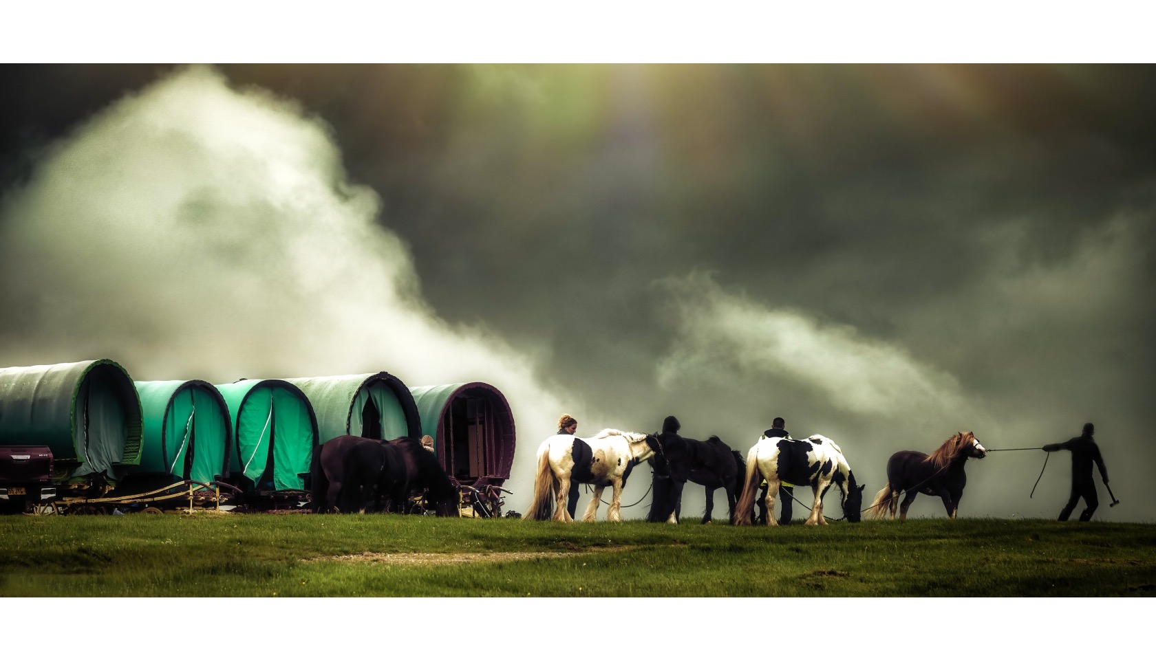 Five vardo wagons, five horses and five people.
