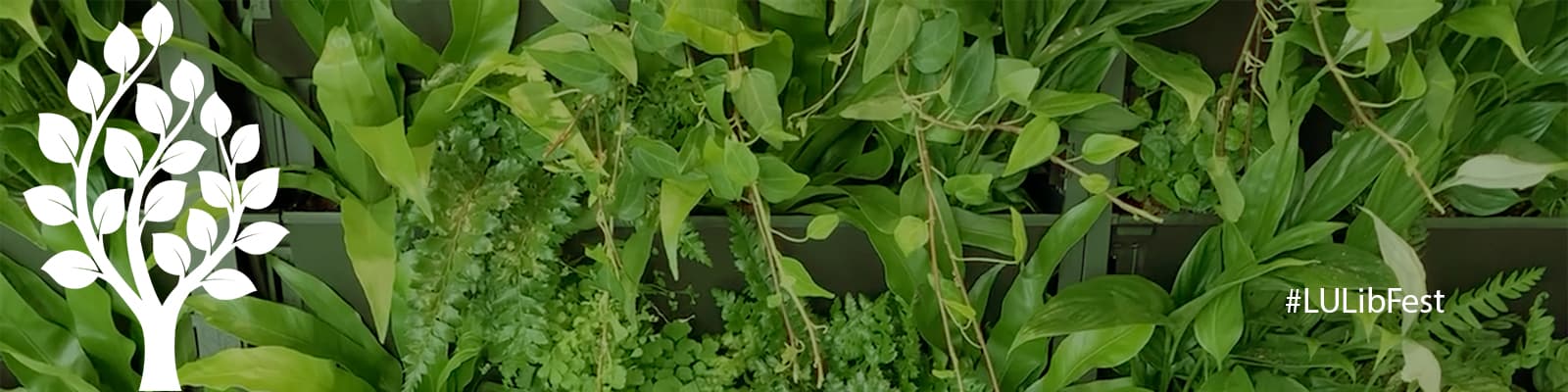 Library festival banner with living wall backdrop