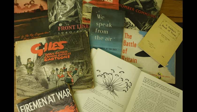 Pamphlets such as Giles Daily Express cartoons depicted. 