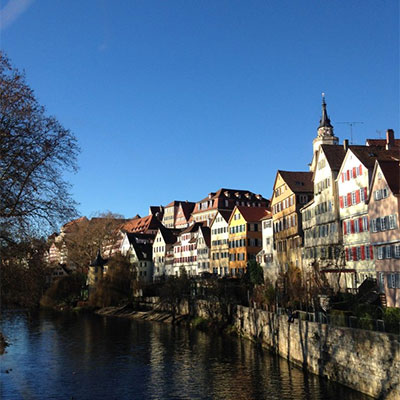 The old houses of the German town of Tubingen run down the side of the river.