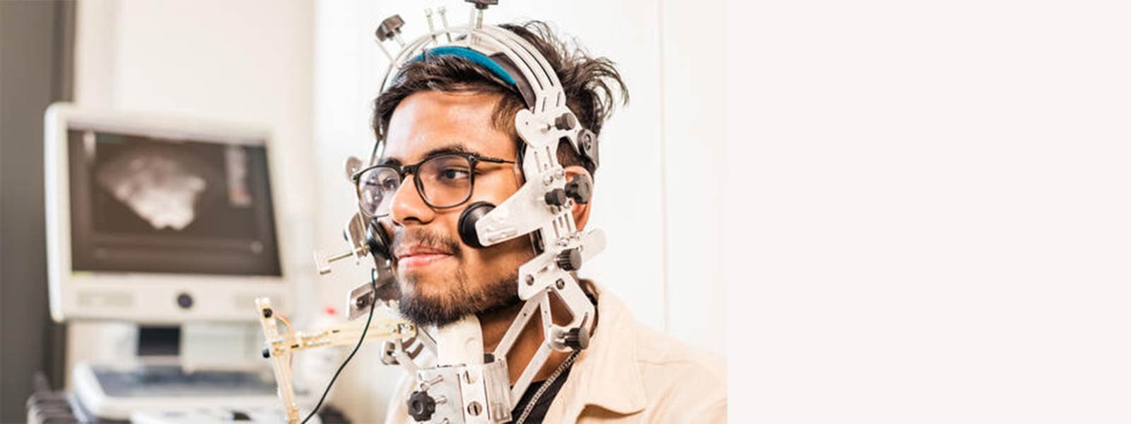 Person using the articulography facilities in the phonetics lab