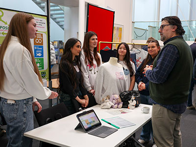 A team discussing their business plan with an event guest