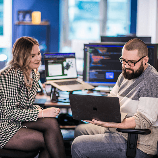Lancashire SME business leader in a meeting with a colleague. 