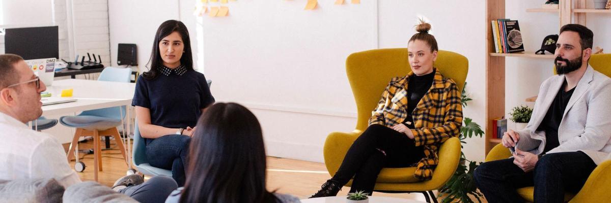 A group of people in a meeting