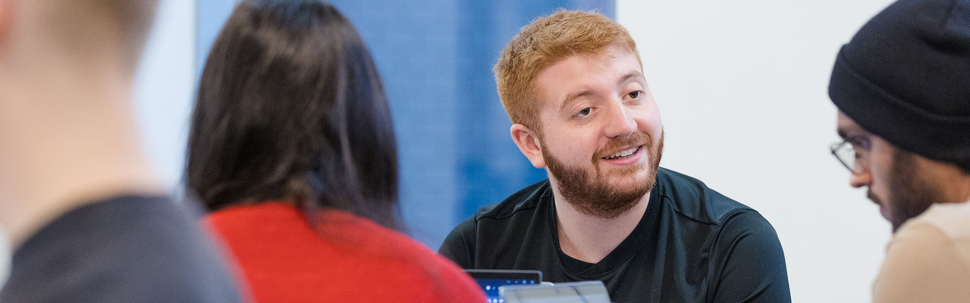 Trio of students sitting around a small table