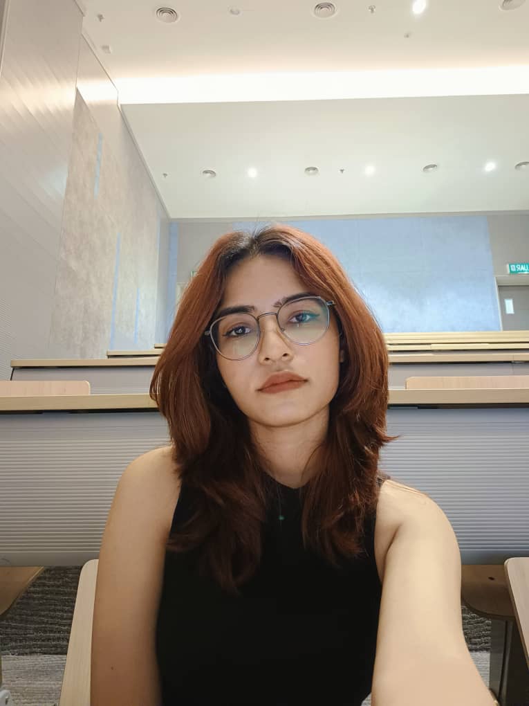 Maria Faruq smiling at the camera.