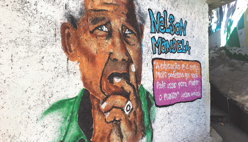 Street art depicting former South African President Nelson Mandela in a Rocinha alleyway.