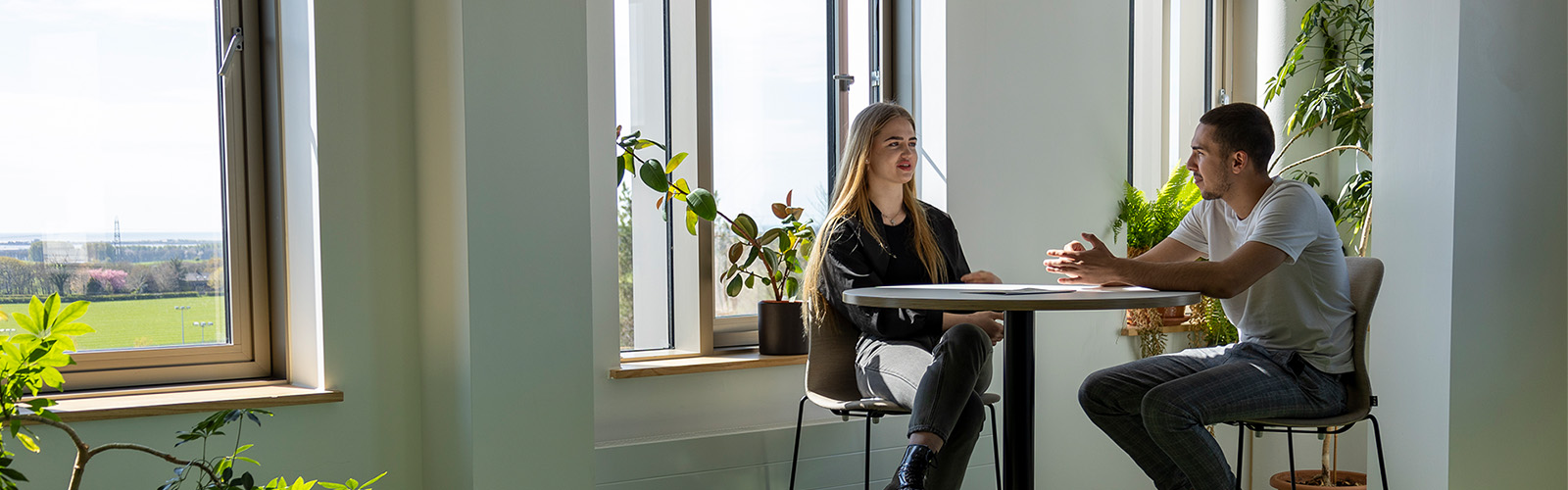 Vineta and Alex, Advertising Society members, in conversation