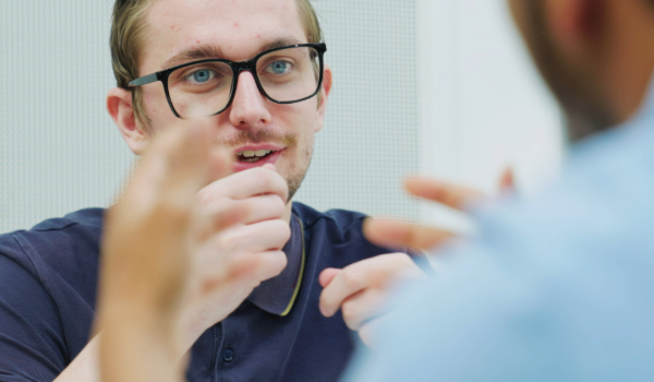 Student talking to another student