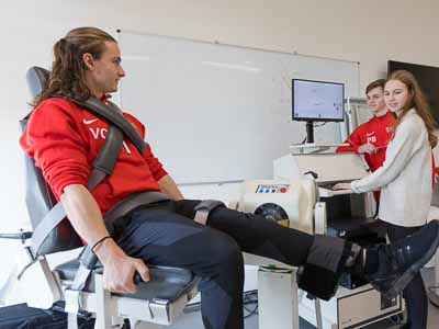 A student being tested on the Biodex machine