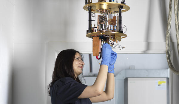 A PhD student working on the components of an ultra low temperature device
