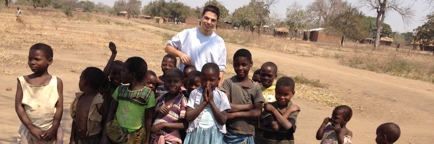 Emanuele with children in a village in Chikhwawa, Malawi &ndash; one of the areas worst affected by malaria 