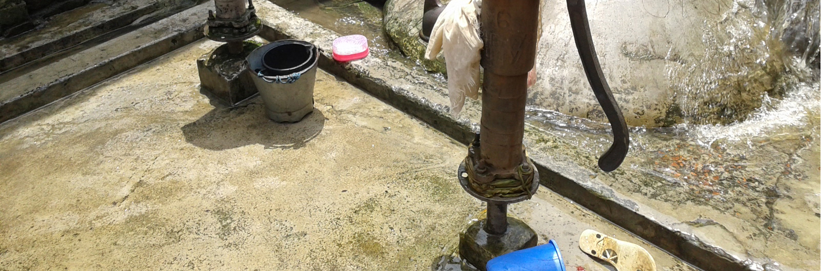 A community standpipe in a Dhaka settlement by Dr Pronob Kumar Mozumder