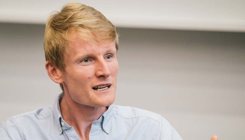 Close shot of Dr Tim Lamont speaking, in a lecture theatre.