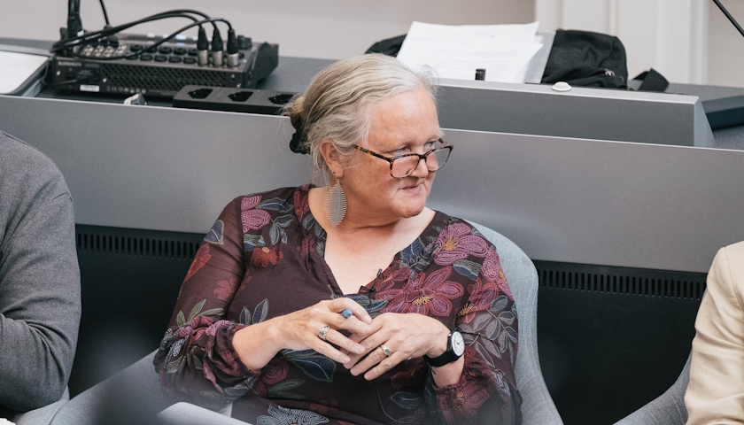 Professor Jan Bebbington chairing a panel of speakers.