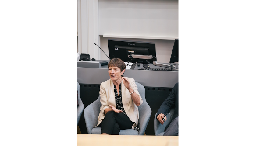 Jane Davidson using her hands to emphasise a point, when speaking.