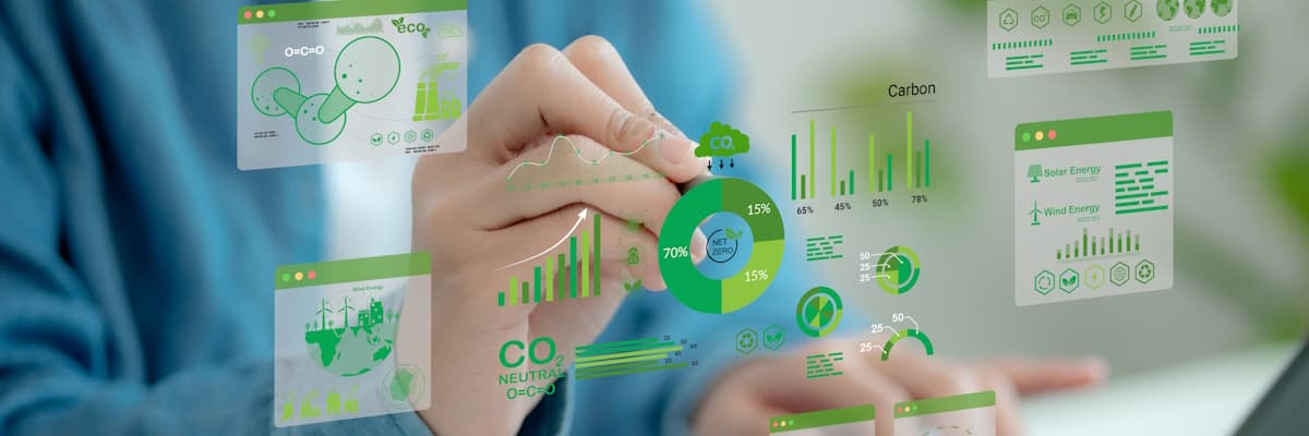 A hand hovers in front of a laptop, in the air we can see floating green-coloured signs and symbols.