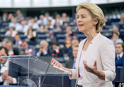 Ursula von der Leyen speaking at a podium