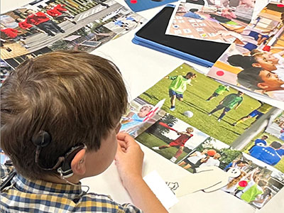 Child looking at different images including a team playing football