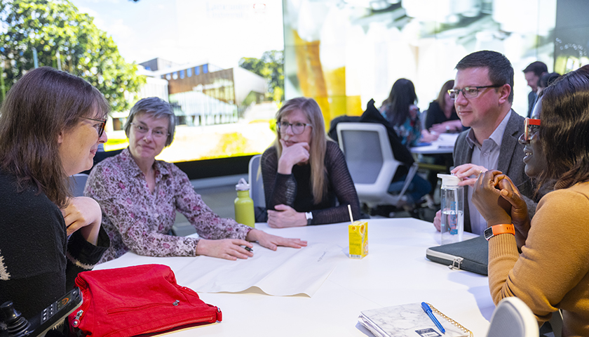 Lancaster staff discussing interdisciplinary research