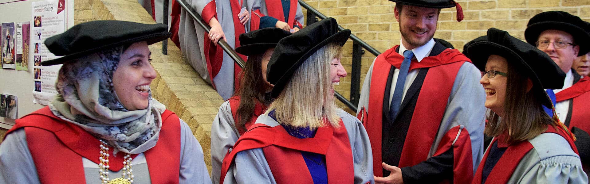 Postgraduate student in great hall at graduation view from above