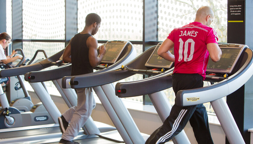 People running on treadmills in the Fitness Suite 