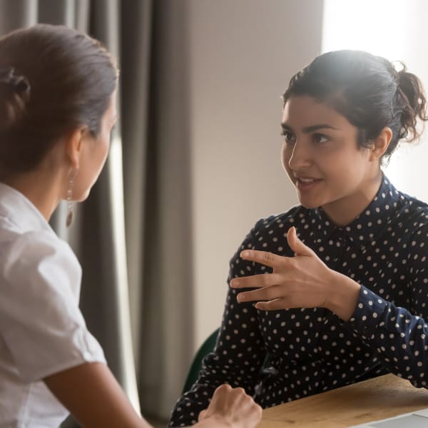 Two people enjoy a conversation