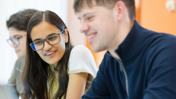 Photo of two MRes students studying
