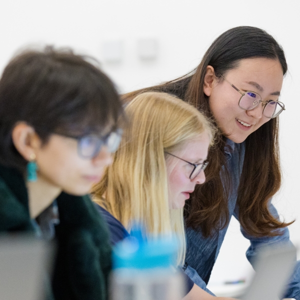 Students sat together, looking at a screen