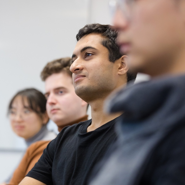 Students sat listening to a Masterclass